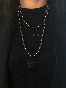 Kathleen wearing ossua-et-acroamata-jewelery-gothic-goth-mythology-spirituality-mysticism-memento-mori-bone-hand-craved-gemstones-beads-antler-deerantler-Dharma_Mala_Necklace